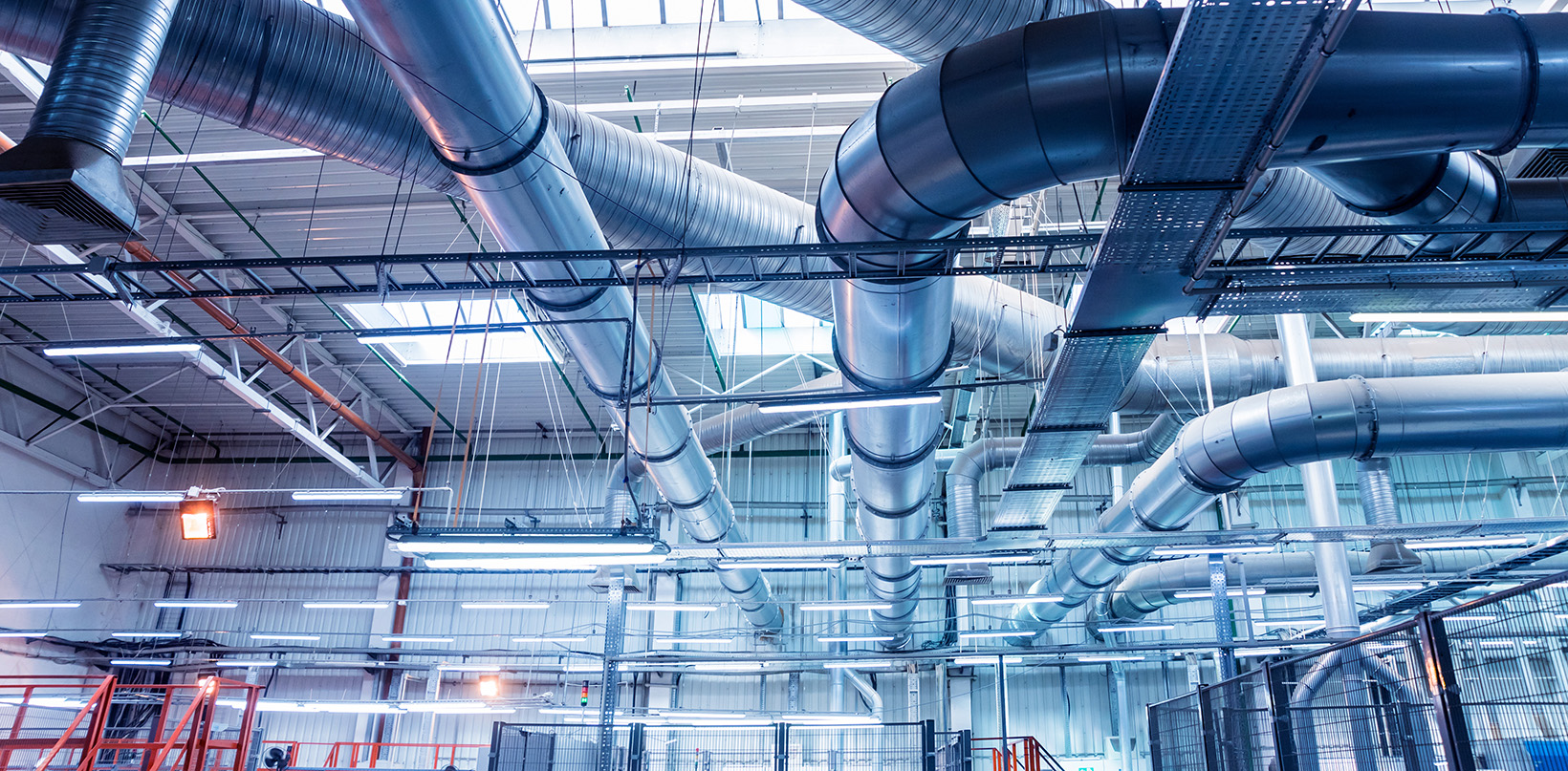 image of airconditioning ducts on a large industrial ceiing